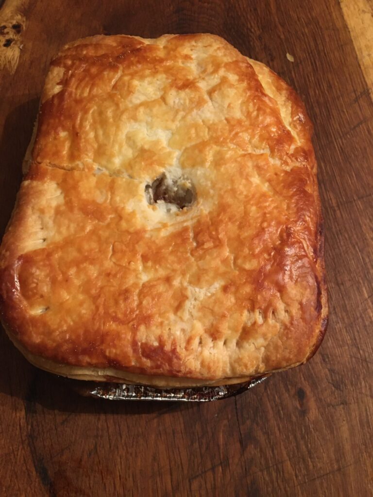 Large cooked wagyu steak pie